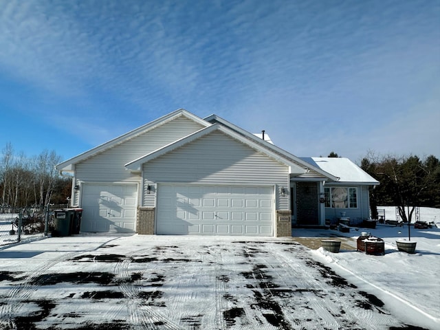 ranch-style home featuring a garage