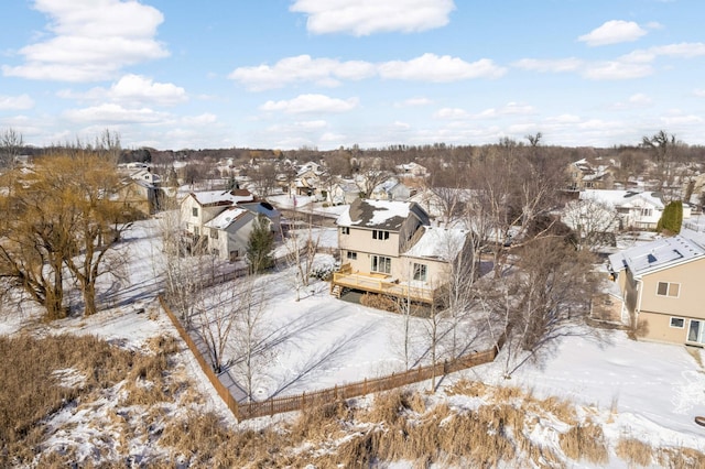 snowy aerial view featuring a residential view