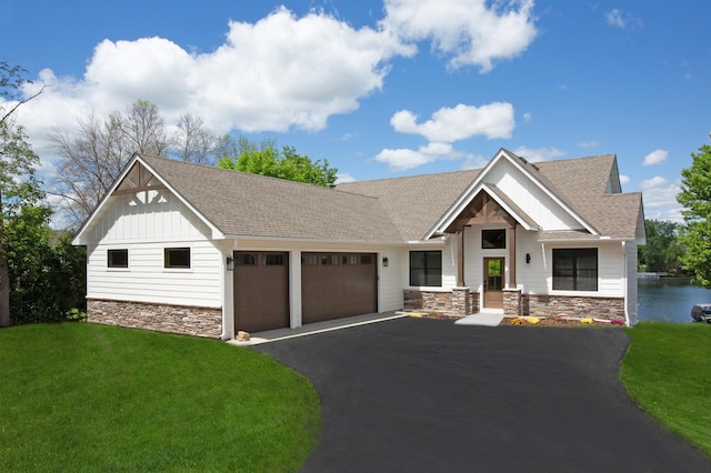 view of front facade with a garage and a front lawn