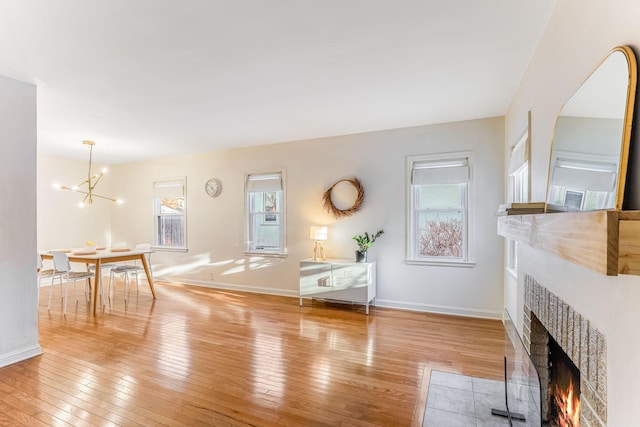 living room featuring light hardwood / wood-style flooring and a chandelier