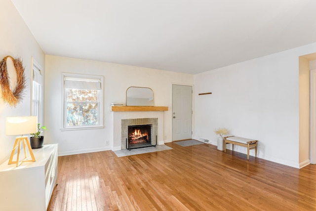 unfurnished living room with light hardwood / wood-style flooring