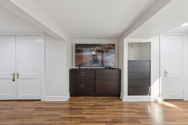 bar with baseboards and wood finished floors