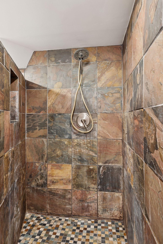 full bathroom with tiled shower