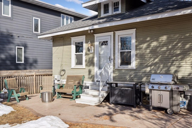 exterior space with a shingled roof