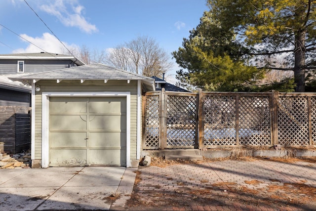 exterior space featuring an outbuilding and fence