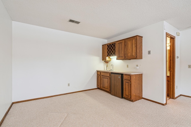 bar featuring light carpet, fridge, visible vents, and indoor wet bar