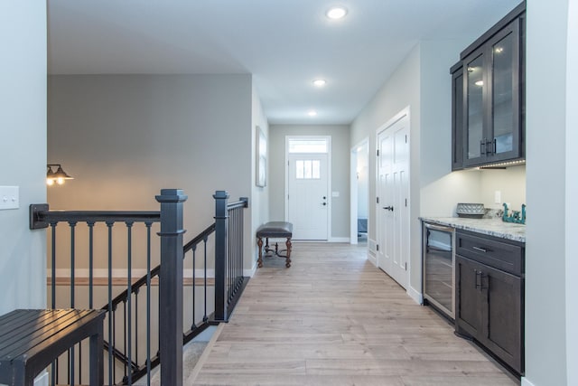 hall featuring wine cooler and light hardwood / wood-style flooring