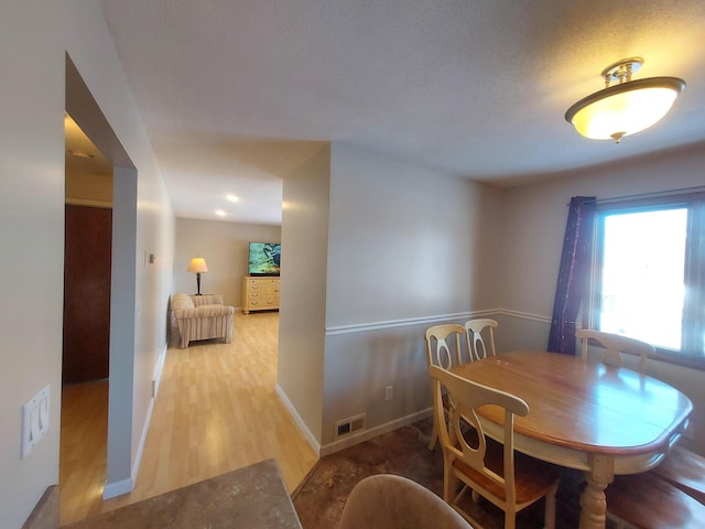 dining space featuring hardwood / wood-style floors