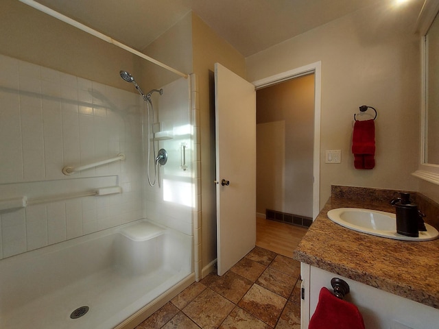 bathroom featuring vanity and walk in shower