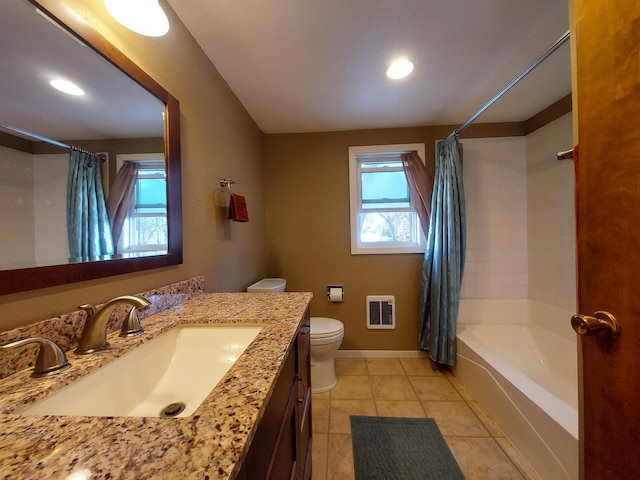 full bathroom featuring toilet, vanity, tile patterned flooring, shower / bath combo, and heating unit