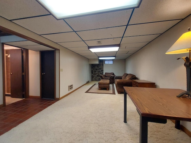 playroom with a drop ceiling and dark colored carpet