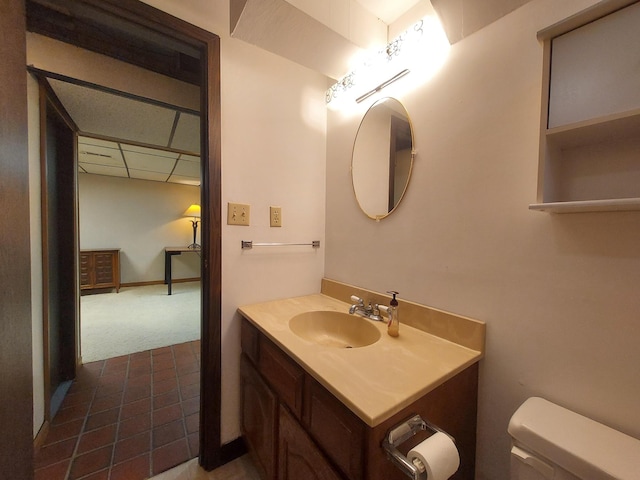 bathroom with toilet and vanity