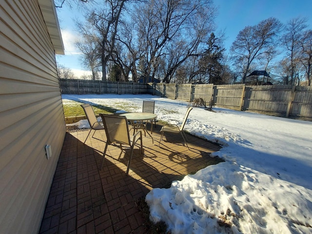 view of snow covered patio