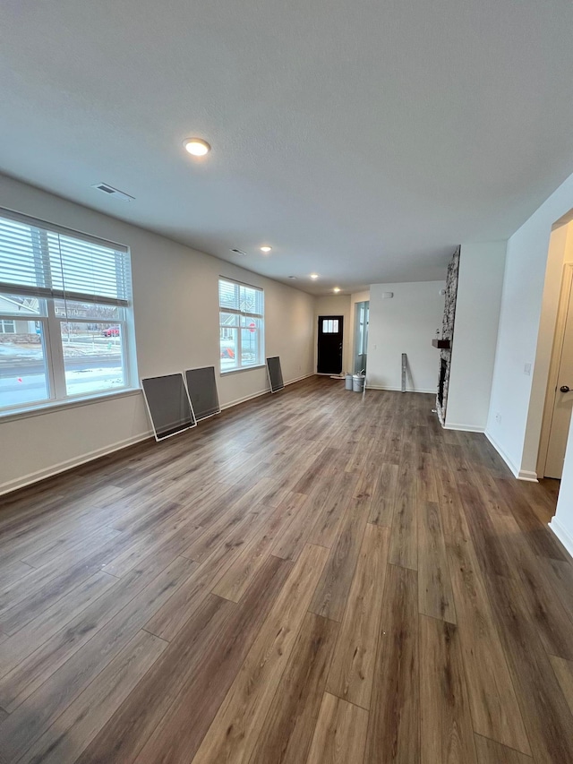 unfurnished living room with hardwood / wood-style floors