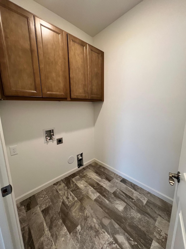 laundry area with hookup for a washing machine, cabinets, and electric dryer hookup