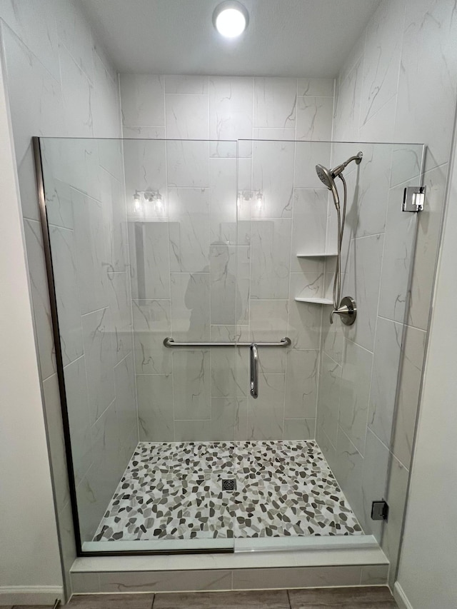 bathroom featuring an enclosed shower