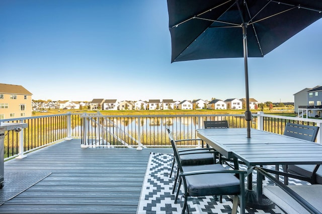 wooden terrace with a water view