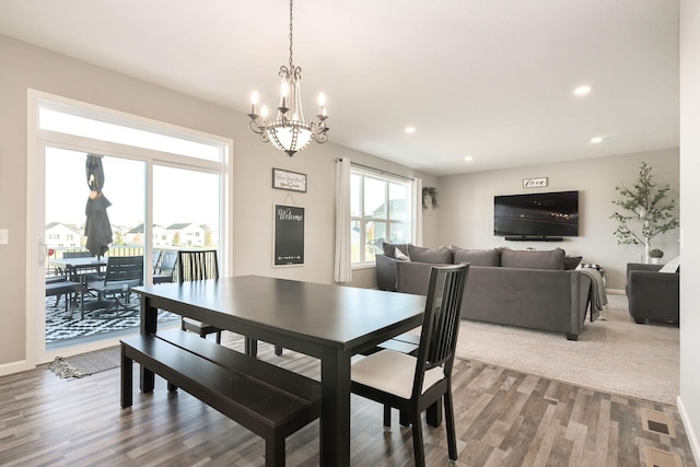 dining room with recessed lighting, visible vents, baseboards, and wood finished floors