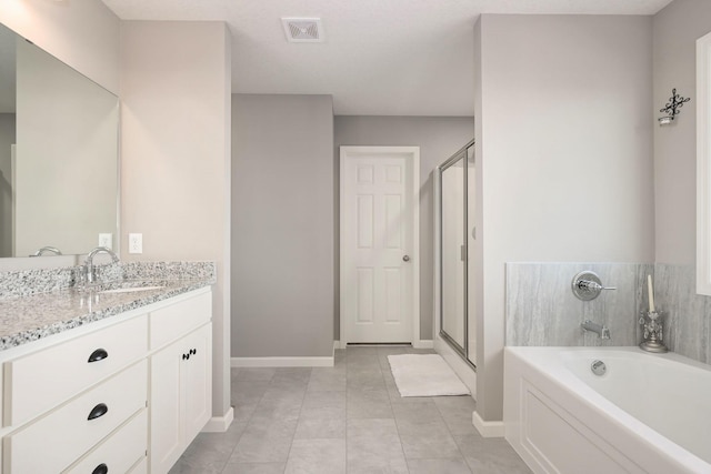 full bath with tile patterned flooring, vanity, visible vents, baseboards, and a bath