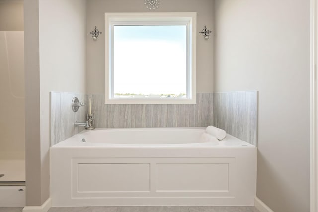 full bath with a garden tub