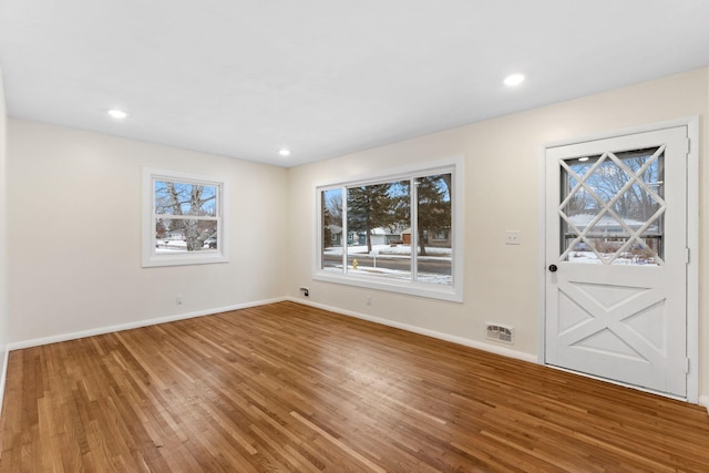 interior space with hardwood / wood-style flooring and a healthy amount of sunlight