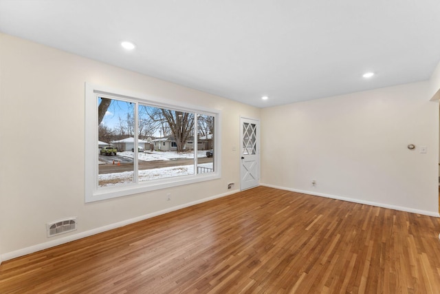 spare room featuring hardwood / wood-style floors