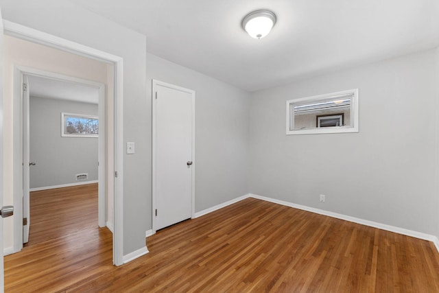 empty room featuring hardwood / wood-style floors