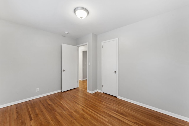 unfurnished room featuring wood-type flooring