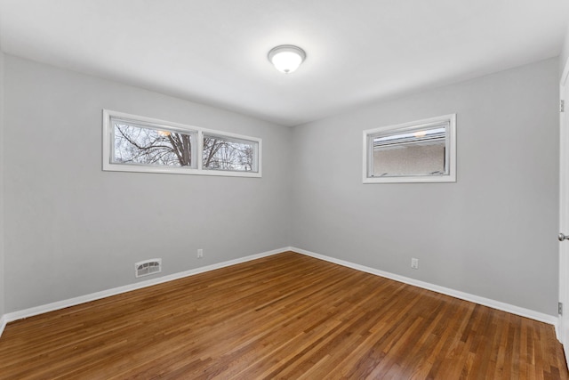 empty room with wood-type flooring