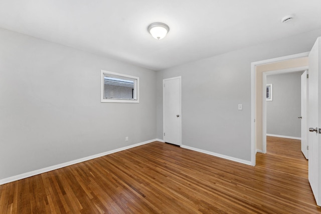 unfurnished room featuring wood-type flooring