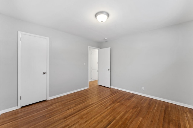 spare room with hardwood / wood-style floors