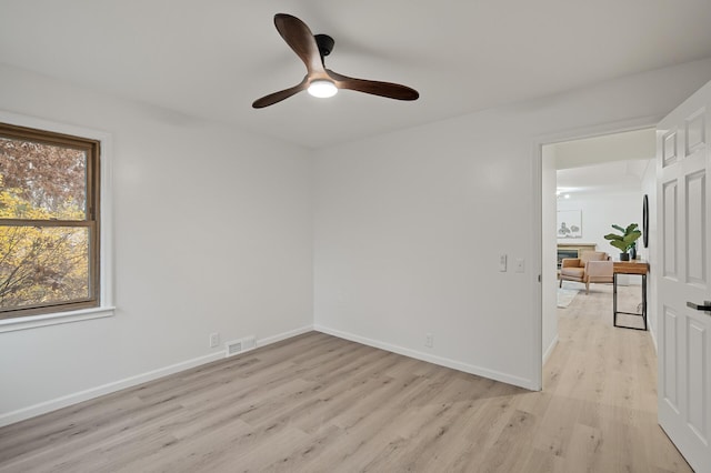 unfurnished room featuring ceiling fan and light hardwood / wood-style floors