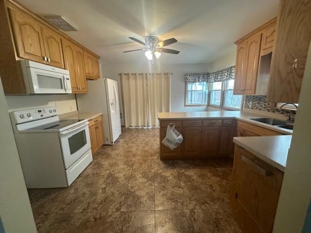 kitchen featuring white appliances, kitchen peninsula, ceiling fan, decorative backsplash, and sink