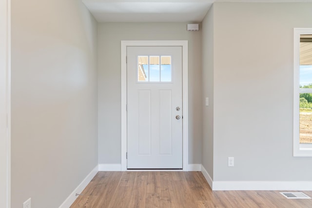 entrance foyer with light hardwood / wood-style flooring