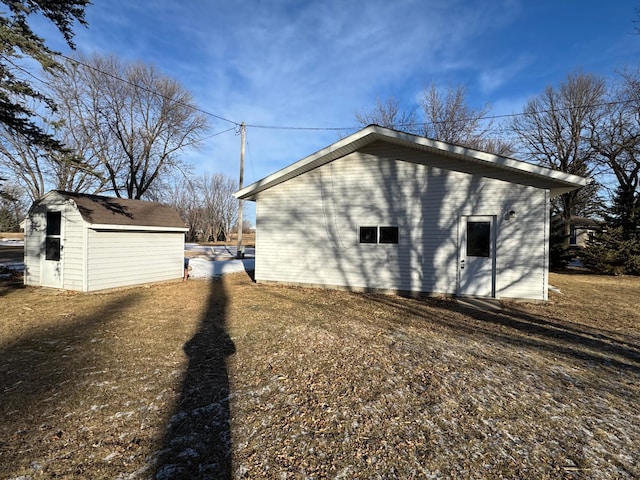 view of property exterior featuring a storage unit