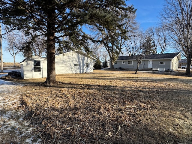 exterior space with a shed