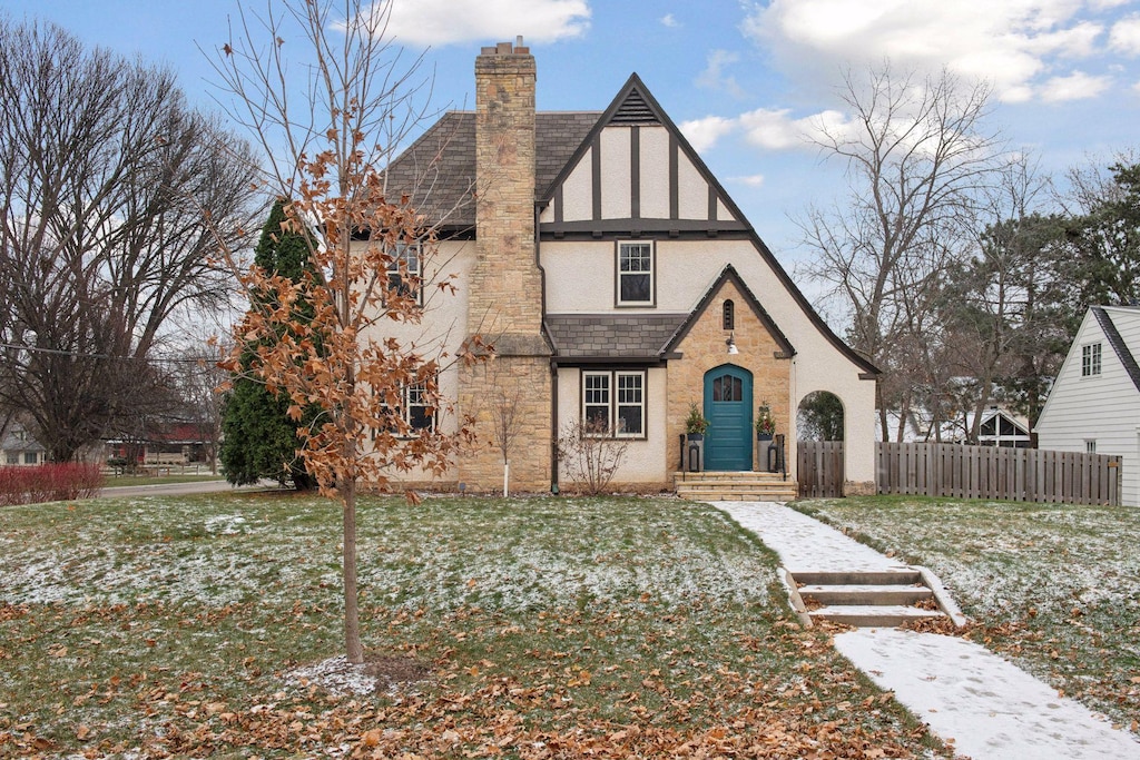 tudor house with a front lawn