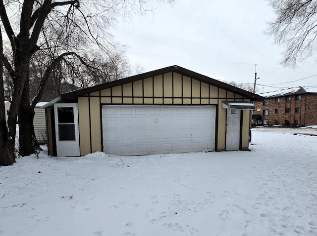 view of snow covered garage