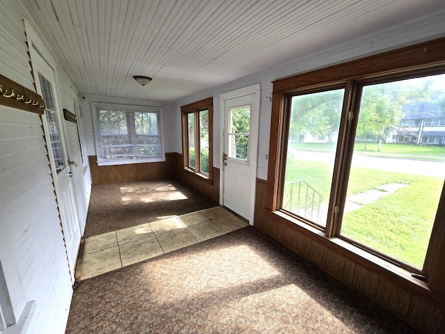 unfurnished sunroom with plenty of natural light