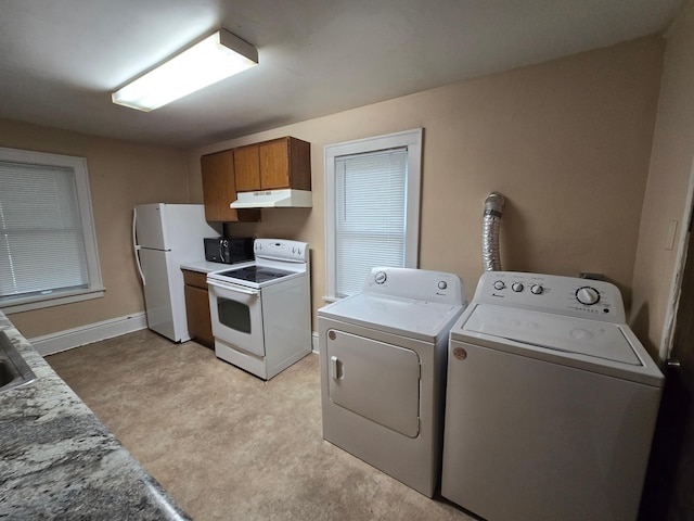 laundry room with washing machine and clothes dryer