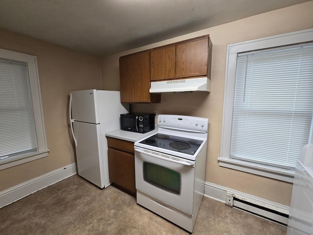 kitchen with white appliances and a baseboard radiator