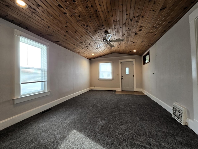 carpeted foyer entrance featuring ceiling fan, vaulted ceiling, and wooden ceiling