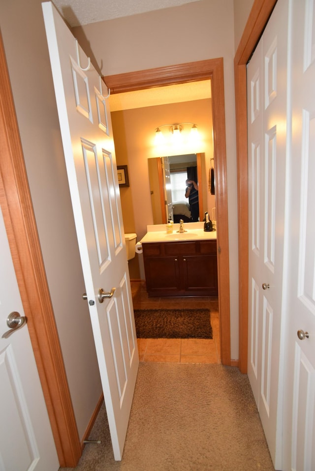 bathroom with tile patterned flooring and vanity