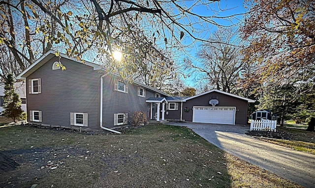 view of front of house with a front lawn and a garage