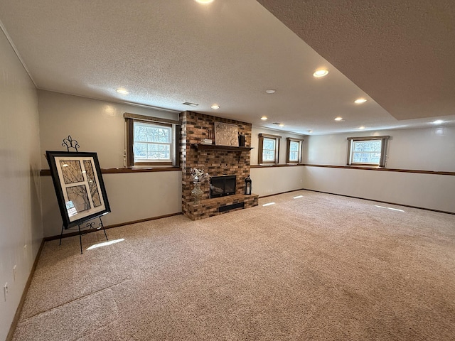 619 10th St, Montevideo, MN 56265 - unfurnished living room with carpet floors, a textured ceiling, recessed lighting, healthy amount of natural light, and a brick fireplace