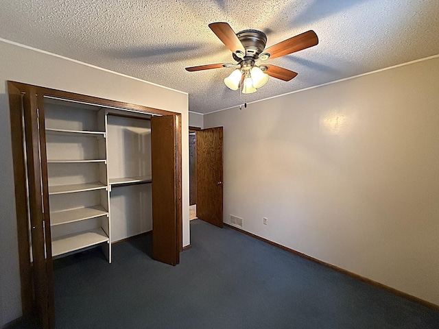 619 10th St, Montevideo, MN 56265 - unfurnished bedroom featuring a closet, a ceiling fan, carpet floors, a textured ceiling, and baseboards
