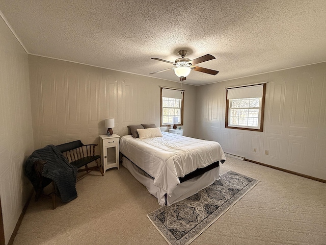619 10th St, Montevideo, MN 56265 - bedroom with light carpet, a ceiling fan, and a textured ceiling