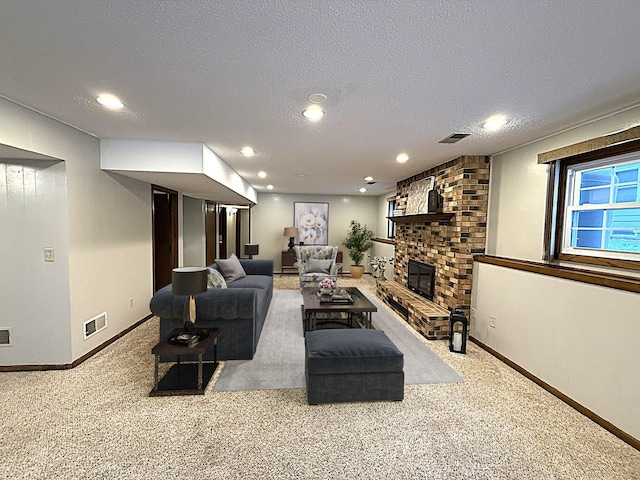 619 10th St, Montevideo, MN 56265 - living room featuring carpet flooring, recessed lighting, baseboards, a fireplace, and a textured ceiling