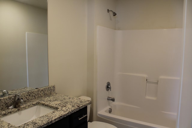 full bathroom featuring tub / shower combination, toilet, and vanity