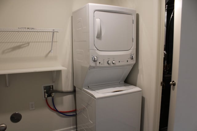 laundry room with stacked washer and clothes dryer